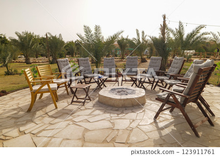 Outdoor Fire Pit Lounge in a Palm Oasis. Saudi Arabia. Outdoor Fire Pit Lounge in a Palm Oasis. Saudi Arabia. 123911761