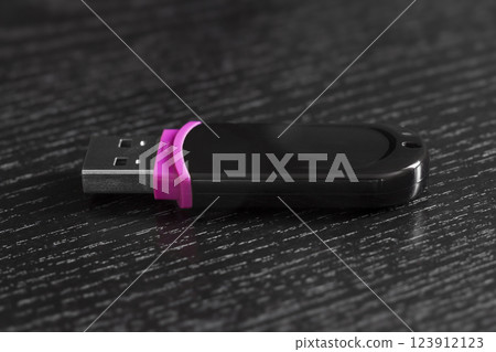 USB flash drive on a black office desk USB flash drive on a black office desk 123912123