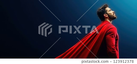 Superhero in Red Cape Against Dark Blue Background 123912378
