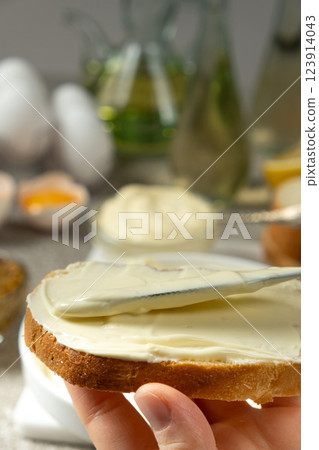 Thick Mayonnaise Spread on Bread Close-Up View Thick Mayonnaise Spread on Bread Close-Up View 123914043