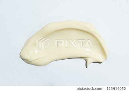 Close-up smear of mayonnaise sauce on white background, top view. Close-up smear of mayonnaise sauce on white background, top view. 123914052