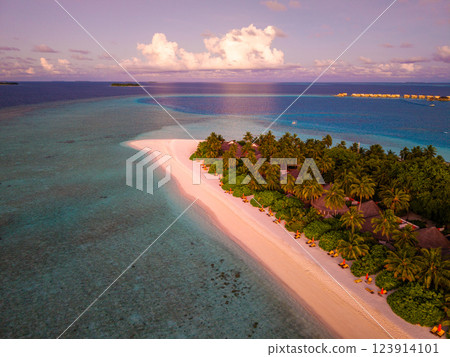 Aerial views of Velavaru Island at sunset in Maldives 123914101