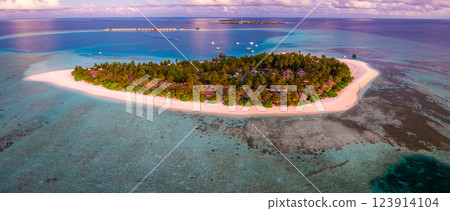 Aerial views of Velavaru Island at sunset in Maldives 123914104