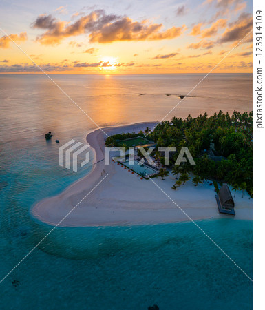 Aerial views of Velavaru Island at sunset in Maldives 123914109