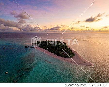 Aerial views of Velavaru Island at sunset in Maldives 123914113