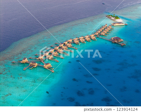 Aerial views of Velavaru Island at sunset in Maldives 123914124