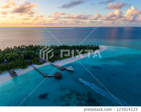 Aerial views of Velavaru Island at sunset in Maldives Aerial views of Velavaru Island at sunset in Maldives 123914125