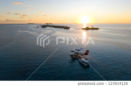Aerial views of Velavaru Island at sunset in Maldives 123914126