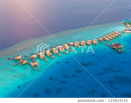 Aerial views of Velavaru Island at sunset in Maldives Aerial views of Velavaru Island at sunset in Maldives 123914132