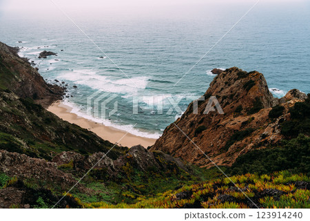 Aroeira Beach. Breathtaking Cape Roca: Cliffs meet the Atlantic Ocean in Portugal with scenic beach. 123914240