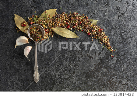 Mix of organic dried spices on a black stone background. 123914428