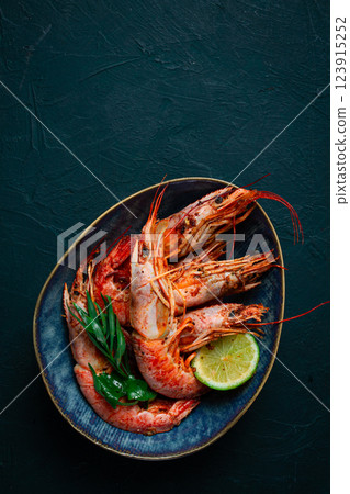 Langoustines, Australian, freshly frozen on ice, top view, lime and greens, 123915252