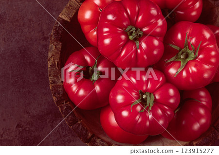Pink tomatoes, in a rustic wooden bowl, close-up, no people, Pink tomatoes, in a rustic wooden bowl, close-up, no people, 123915277