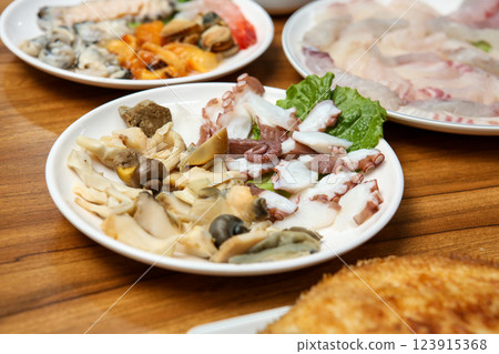 Korean seafood dish. Boiled conch and octopus sashimi Korean seafood dish. Boiled conch and octopus sashimi 123915368