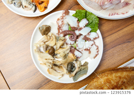 Korean seafood dish. Boiled conch and octopus sashimi 123915376