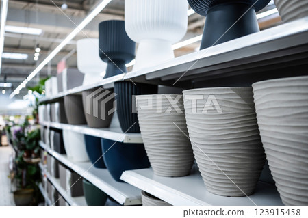 Ceramic Pots For Home Plants And Flowers On Shelves In Supermarker Ceramic Pots For Home Plants And Flowers On Shelves In Supermarker 123915458