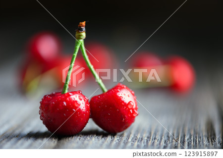 Macro shot of two ripened red cherries 123915897