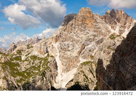 Amazing views of the picturesque high Dolomites mountains, lawns and forest 123916472