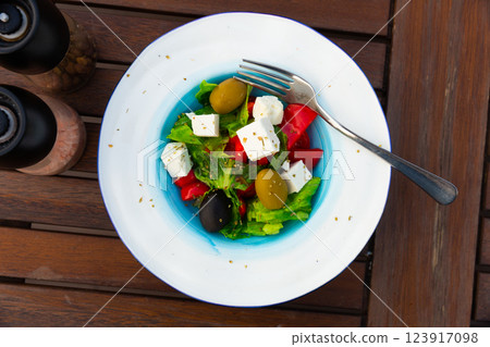 Salad with olives, tomatoes, cucumber and feta cheese - greek vegetable salad. Traditional mediterranean cuisine 123917098