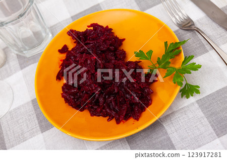 Portion of salad made of boiled and grated beetroot Portion of salad made of boiled and grated beetroot 123917281
