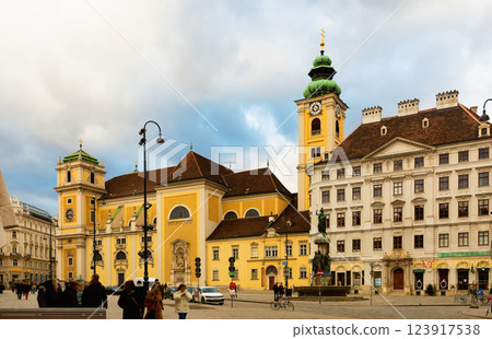 Church Schottenkirche and Schottenstift monastery on square in Vienna 123917538
