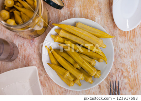 Pile of pickled okra served on table 123917688