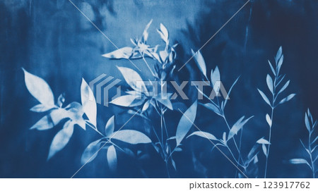 abstract cyanotype botanical composition with soft light diffusion, delicate plant shadows, deep indigo and navy blue textures, artistic organic nature-inspired print with vintage aesthetics 123917762