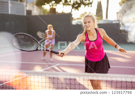 Woman tennis player training on court Woman tennis player training on court 123917798