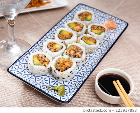 Sake Cooked Roll with fried salmon, avocado, and fried onion 123917858
