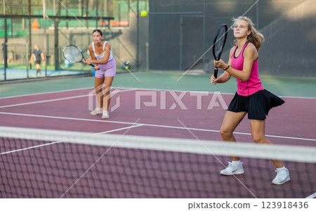 Portrait of emotional woman tennis player during friendly doubles couple match Portrait of emotional woman tennis player during friendly doubles couple match 123918436