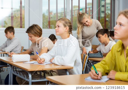 Student is sitting test and answer about task in classroom. 123918615