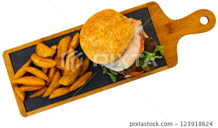 Delicious cheeseburger with beef patty and cheese on plate, with french fries 123918624