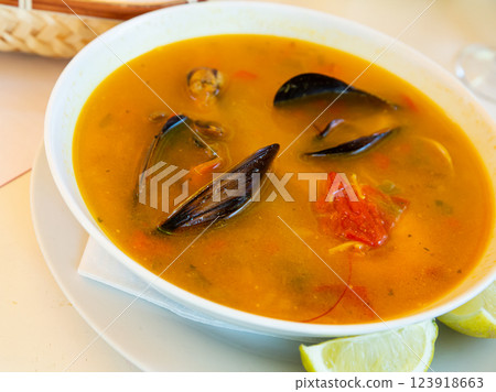 Spicy seafood soup with king prawns; shellfish and octopus Spicy seafood soup with king prawns; shellfish and octopus 123918663