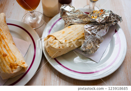 Turkish wrapped dish durum on white plate Turkish wrapped dish durum on white plate 123918685