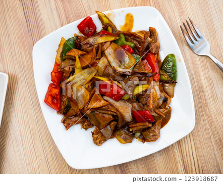 Stewed pork with pepper and green onions is traditional dish of Chinese cuisine Stewed pork with pepper and green onions is traditional dish of Chinese cuisine 123918687