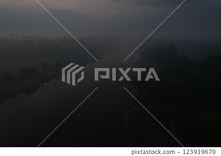 Misty dawn over a serene river in the Amazon rainforest Misty dawn over a serene river in the Amazon rainforest 123919670