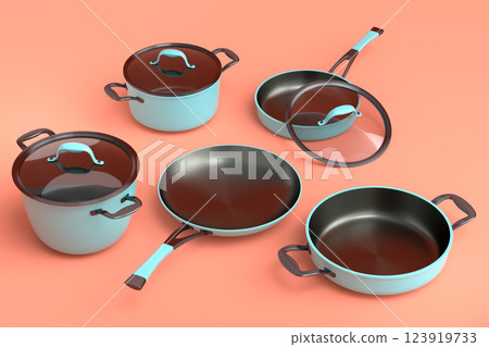 Set of flying stewpot, frying pan and chrome plated cookware on orange 123919733