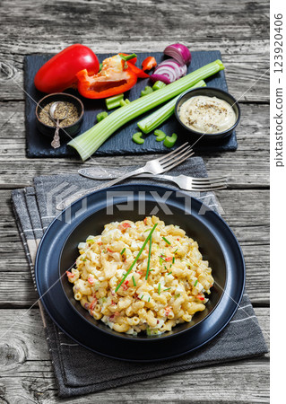 macaroni salad with celery, eggs, red bell pepper macaroni salad with celery, eggs, red bell pepper 123920406