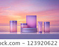 Pastel-colored cosmetic products with a sunset background 123920622