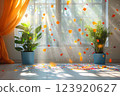 A sunlit window with green plants in blue pots and colorful confetti floating in the air, festive and joyful atmosphere 123920627