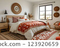 Cozy boho bedroom with warm earthy tones 123920659