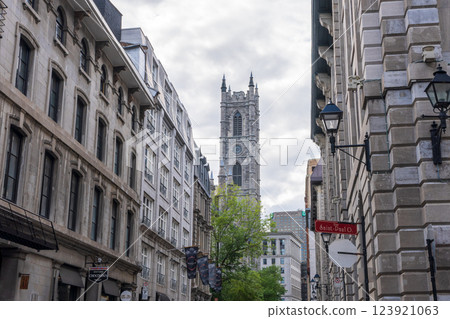 Montreal, Quebec, Canada - August 2 2021 : Street view in Old Montreal. Retro style building in Saint-Sulpice Street (Rue Saint-Sulpice). 123921063
