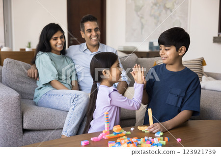 Children play together, give high five, start or finish game Children play together, give high five, start or finish game 123921739