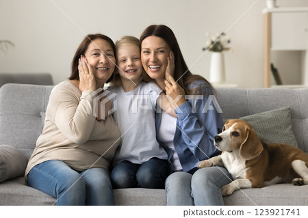 Three generations of women and beagle dog, home portrait Three generations of women and beagle dog, home portrait 123921741
