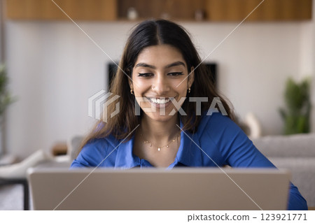 Young Indian student woman studying on-line using laptop Young Indian student woman studying on-line using laptop 123921771