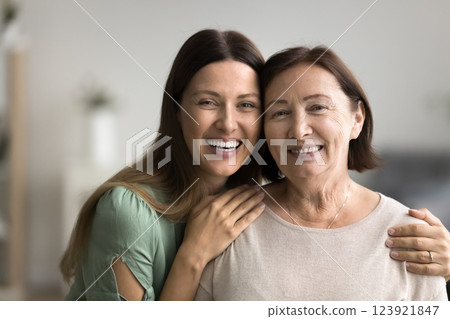 Close up headshot two diverse beautiful women posing for camera 123921847