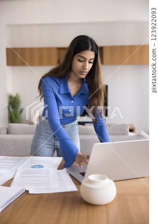 Woman preparing coursework related to business, finance, or research Woman preparing coursework related to business, finance, or research 123922093