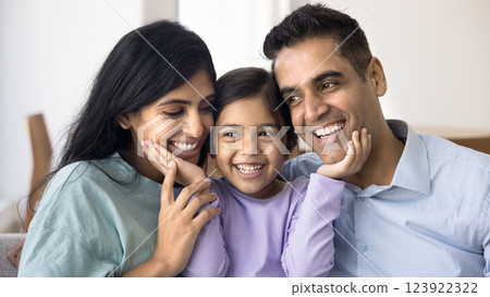 Closeup portrait of happy Indian father, mother and their daughter Closeup portrait of happy Indian father, mother and their daughter 123922322