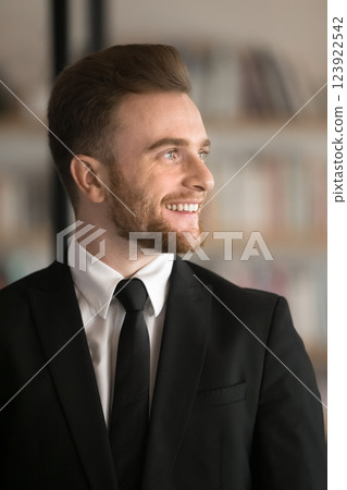 Handsome young businessman wear formal suit look forward with smile Handsome young businessman wear formal suit look forward with smile 123922542