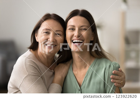 Close up portrait of happy elderly woman and her daughter 123922620